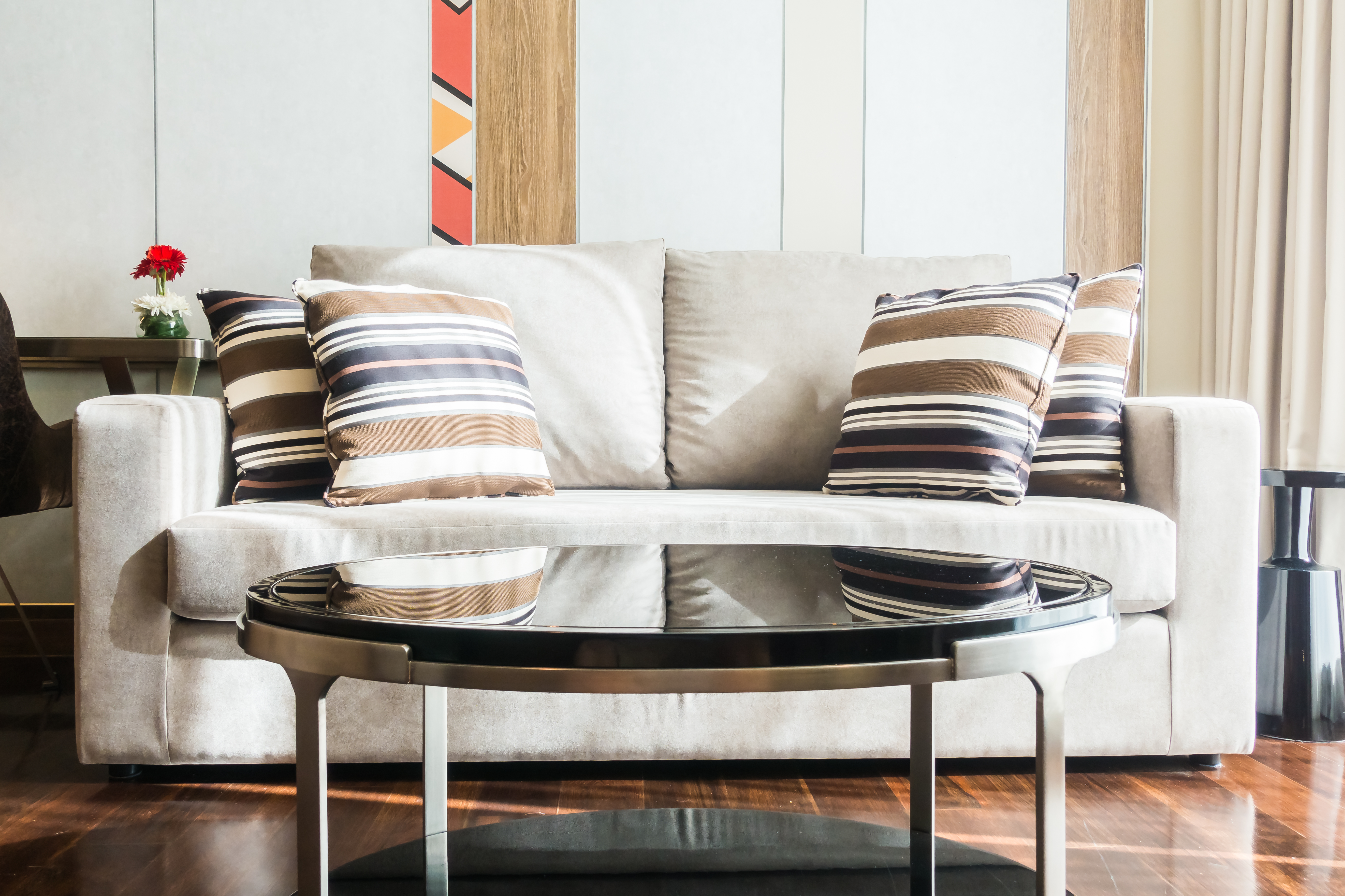 Modern living room with couch and glass table